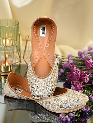 Ivory Handcrafted Leather Juttis With Mirror Work
