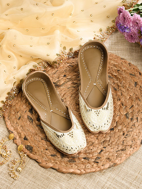 White Handcrafted Leather Juttis With Mukaish Work