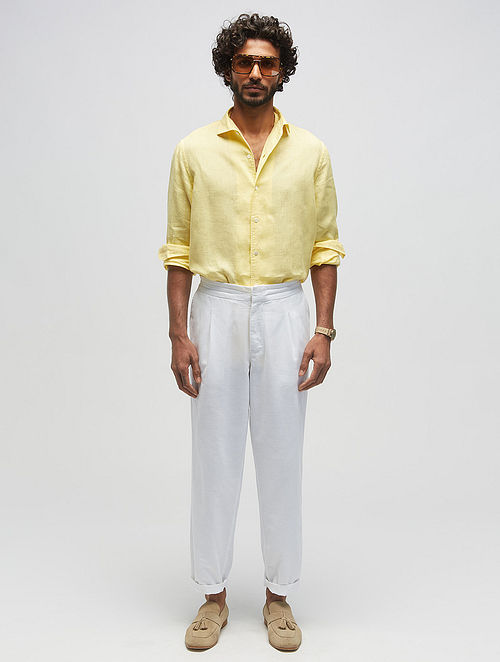 Good to hear from you. Dressing in white shirt, yellow pants, wearing  sunglasses, a young guy